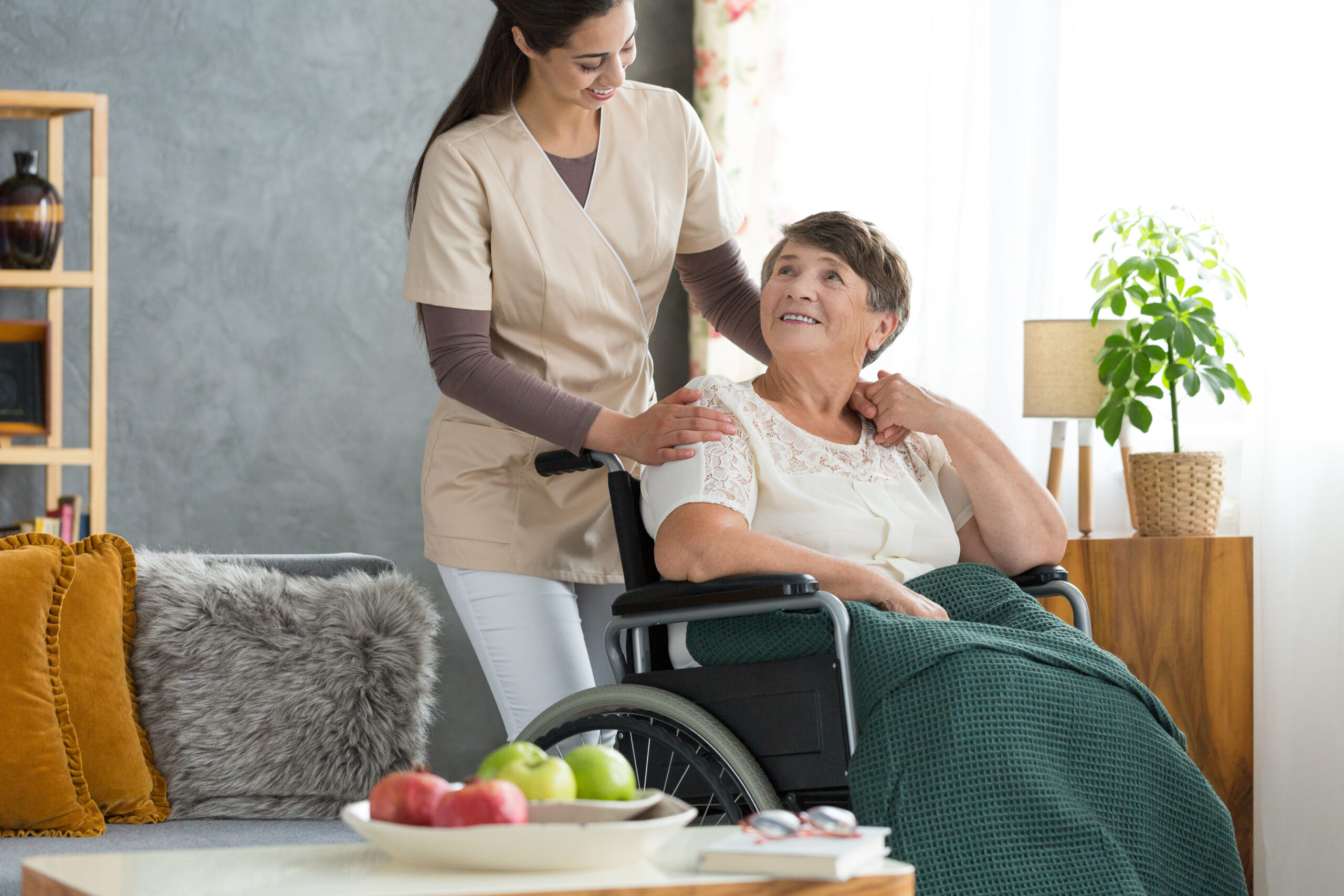 Amazing Grace Homecare – Home Care Caregiver assisting an elderly client with meal preparation and daily activities in Plainville, Kansas.