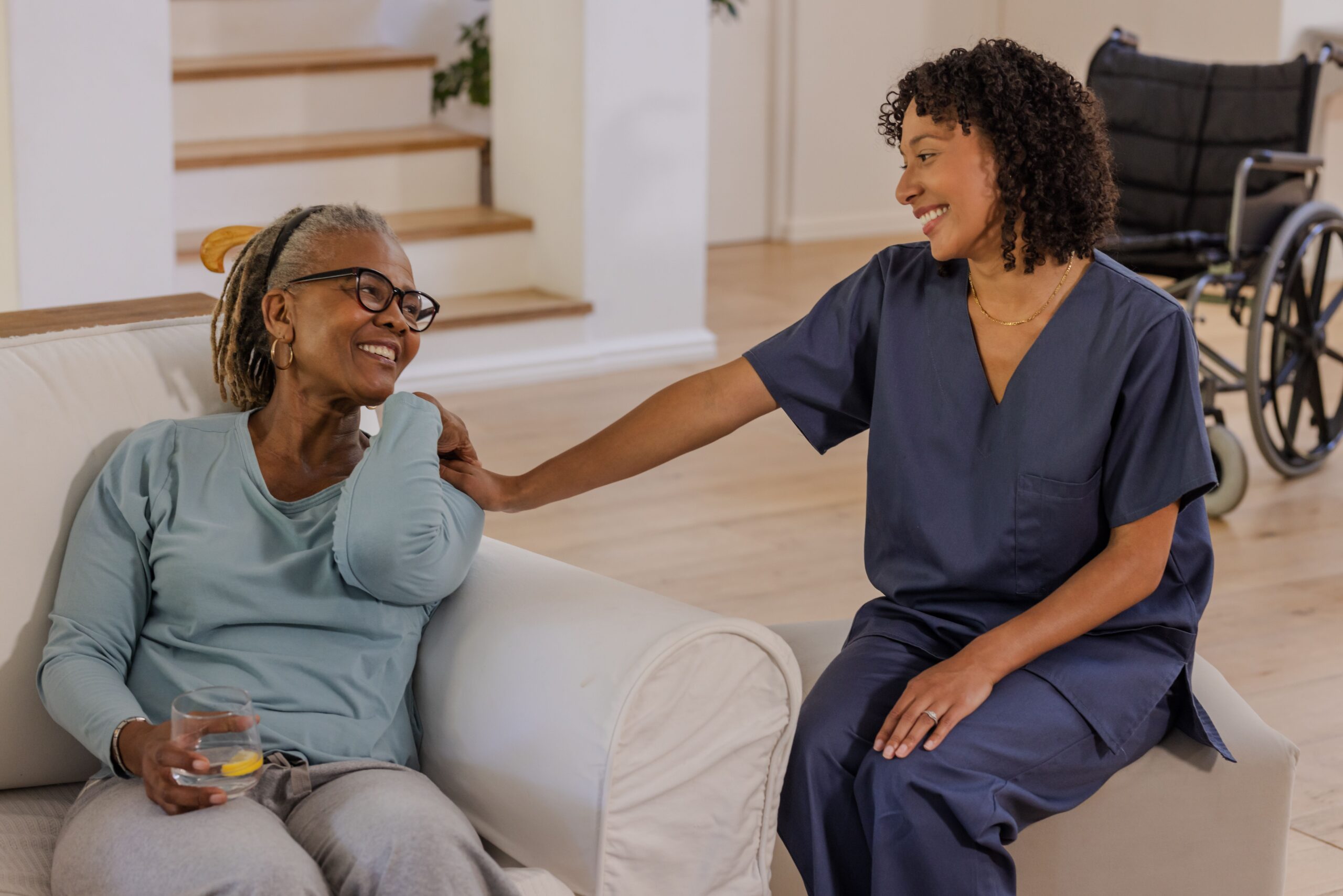 Home Care in Hays, KS A compassionate home caregiver in Hays, KS providing trusted home care services to an older adult in the comfort of home.